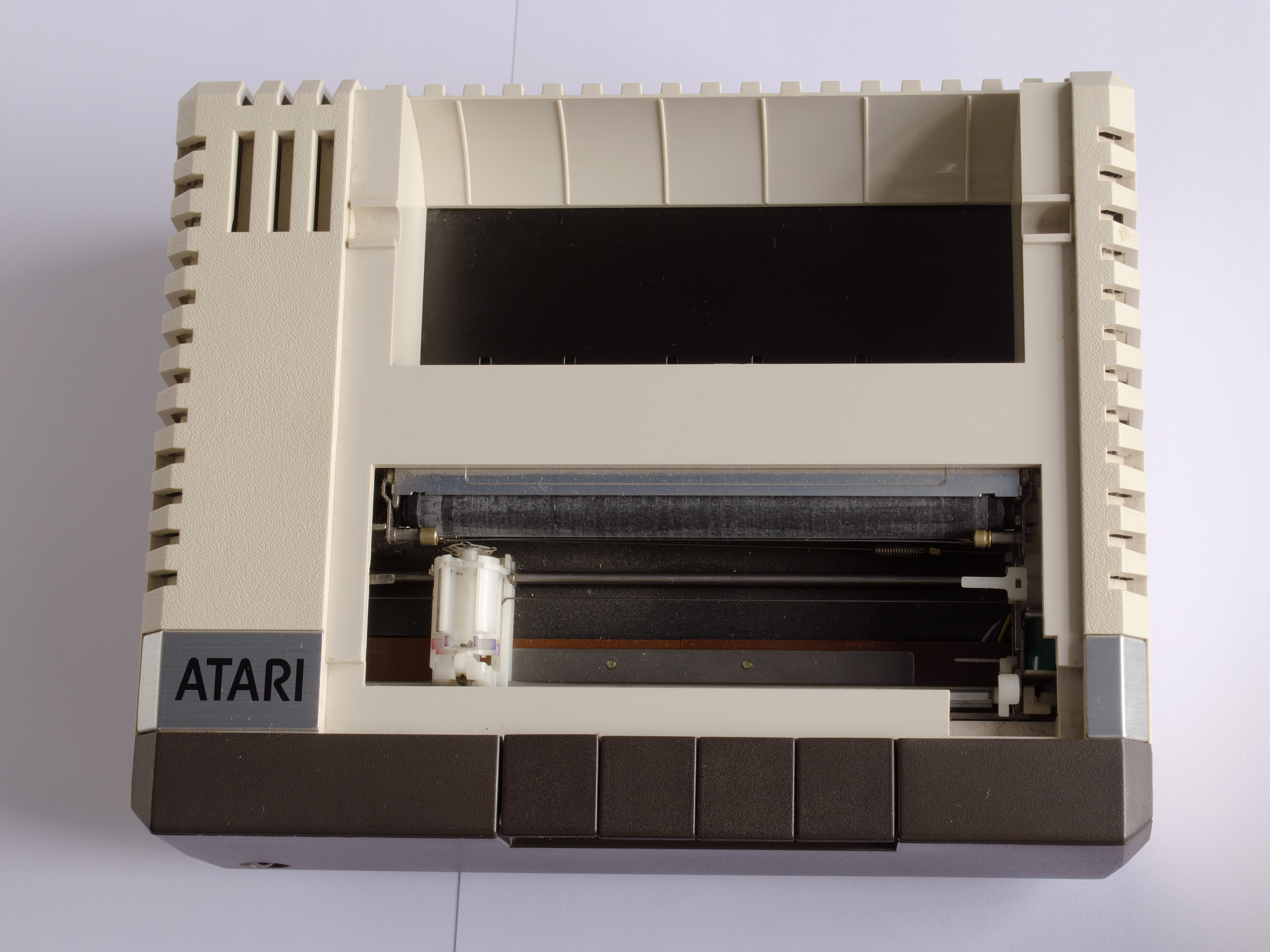 Atari 1020 with cover removed, showing the pen carriage mechanism, turret, and paper drum