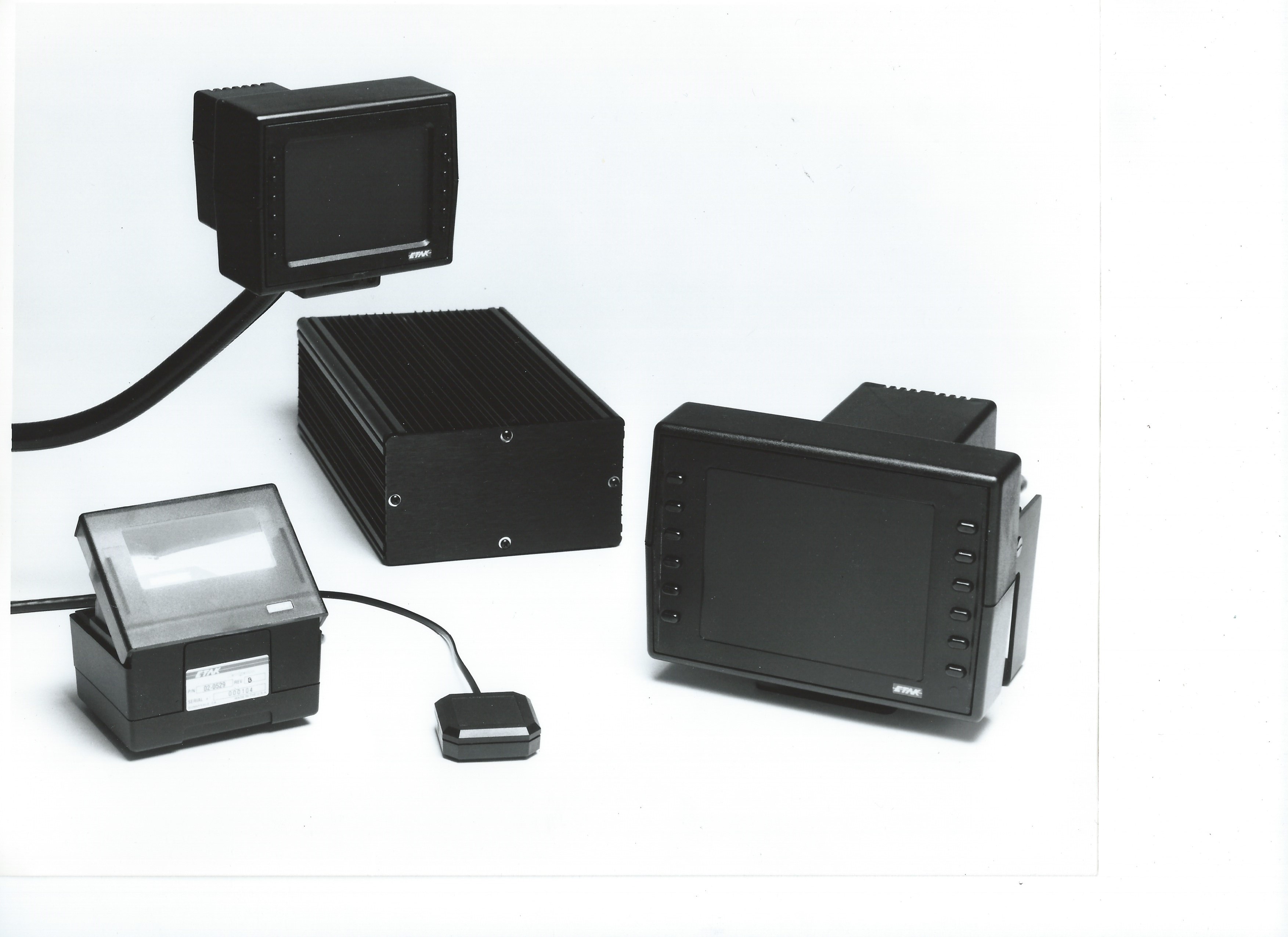 Etak Navigator hardware components: computer unit, display, cassette tapes, wheel sensors, and compass