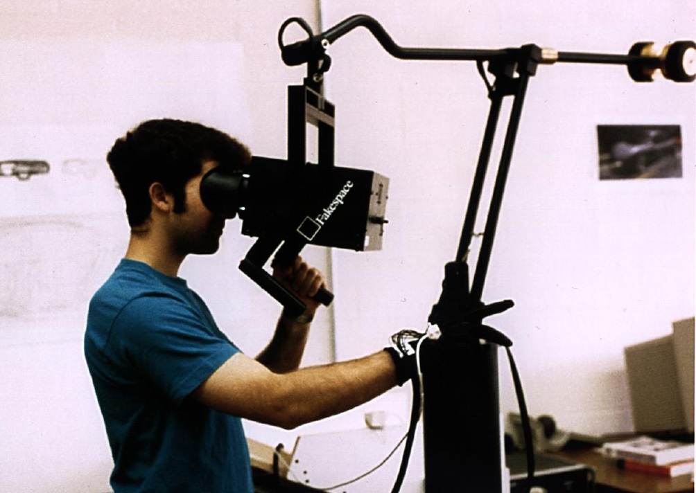 User operating a Fakespeare BOOM display, peering into the viewing hood