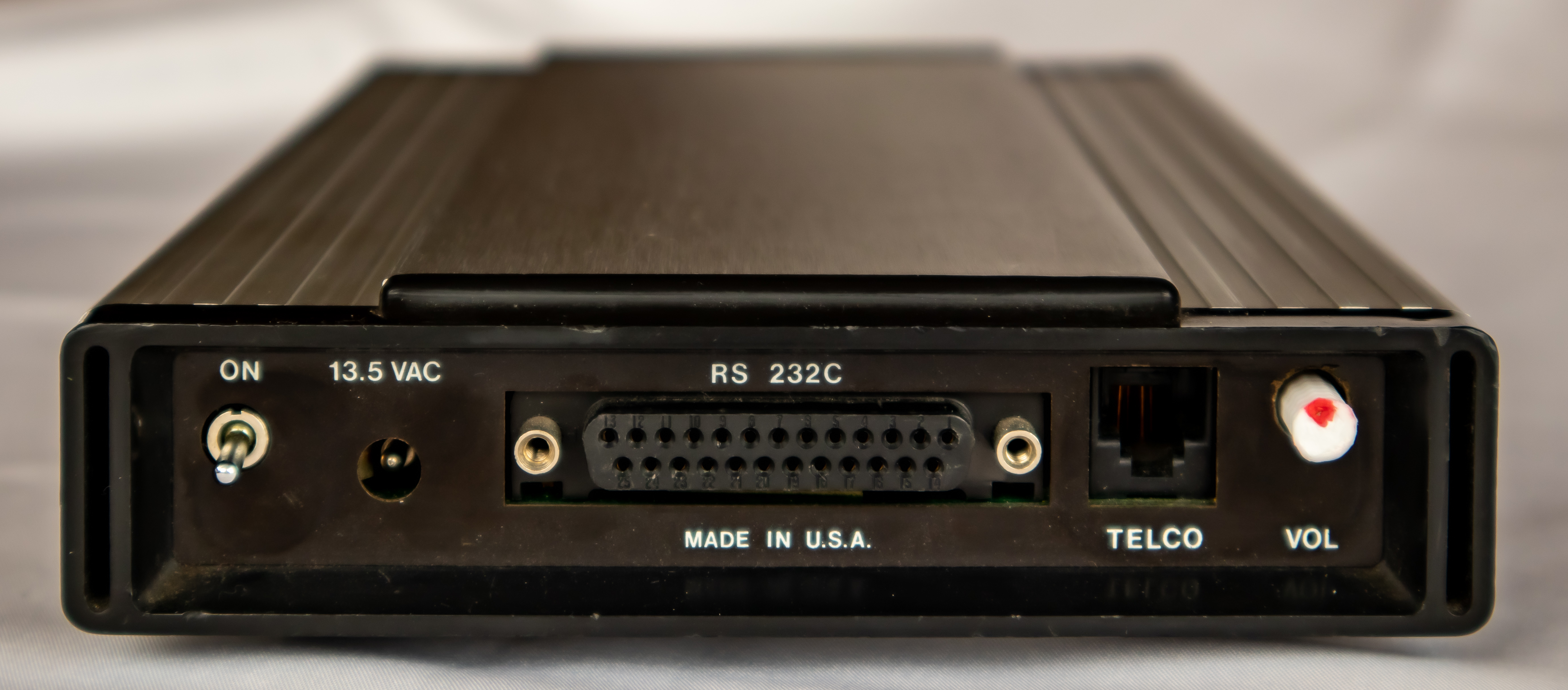 Rear panel of the Hayes Smartmodem showing DB-25 RS-232 port, RJ-11 jack, and volume control