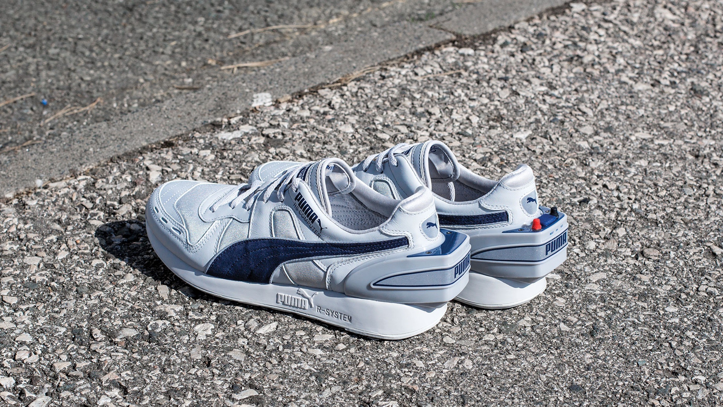 PUMA RS-Computer shoe with 16-pin serial cable connected to an Apple IIe computer