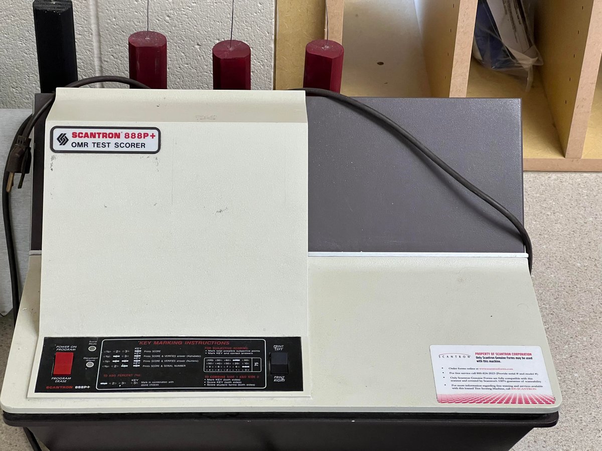 Scantron 888P+ machine on a school desk