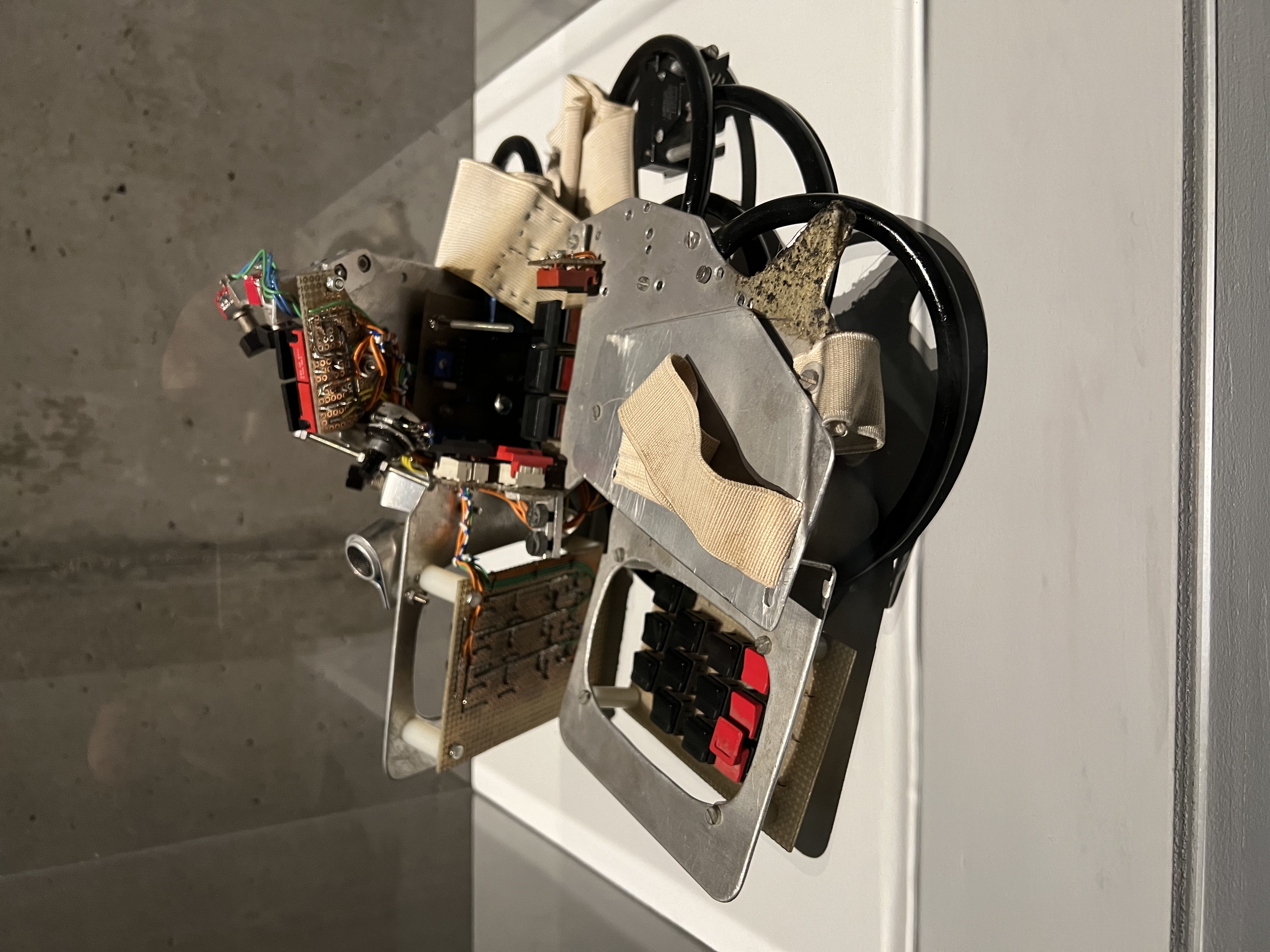 Close-up of The Hands being worn, showing the wooden frames, sensors, and wiring