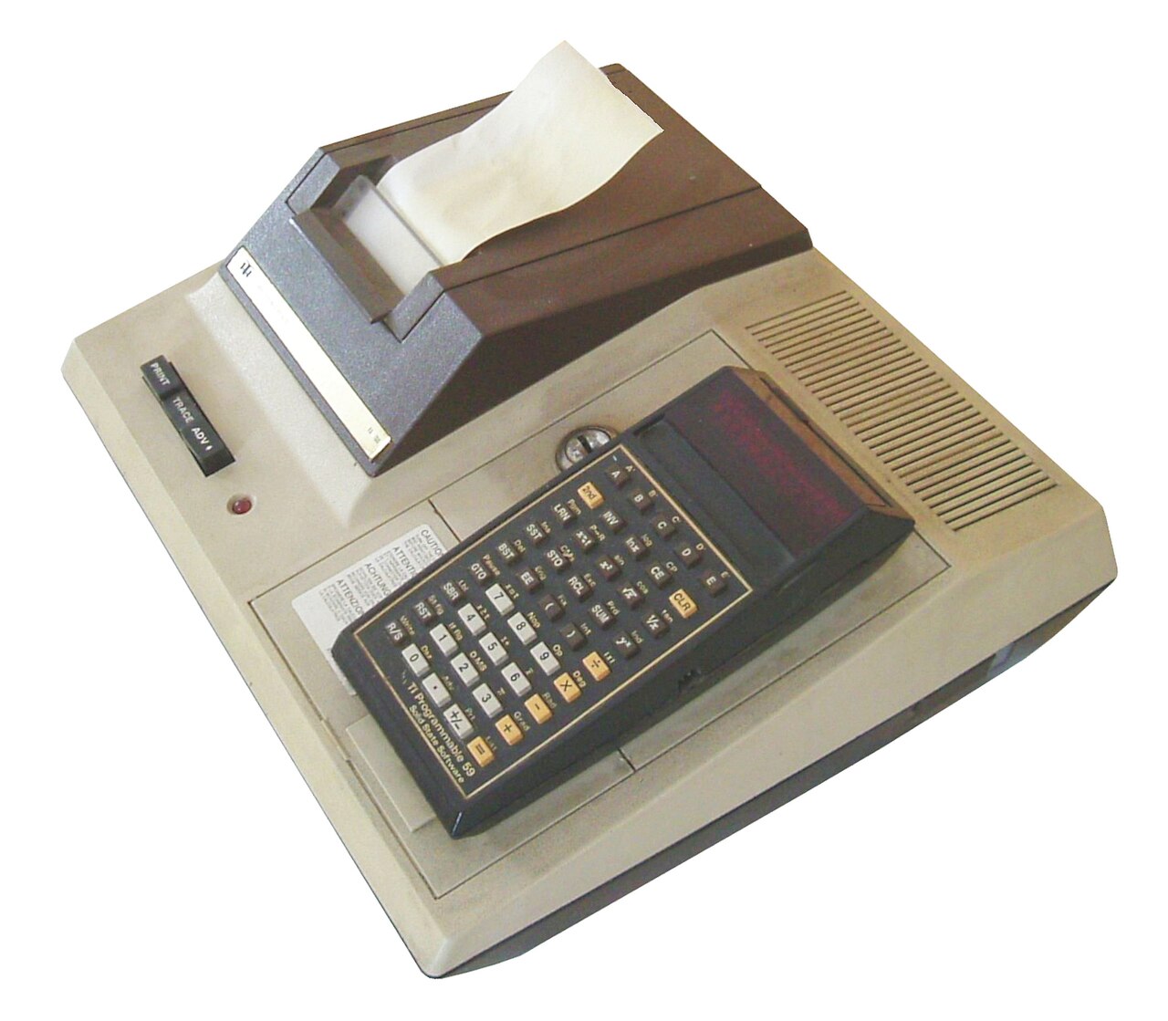 A TI-59 docked on the PC-100 thermal printer cradle