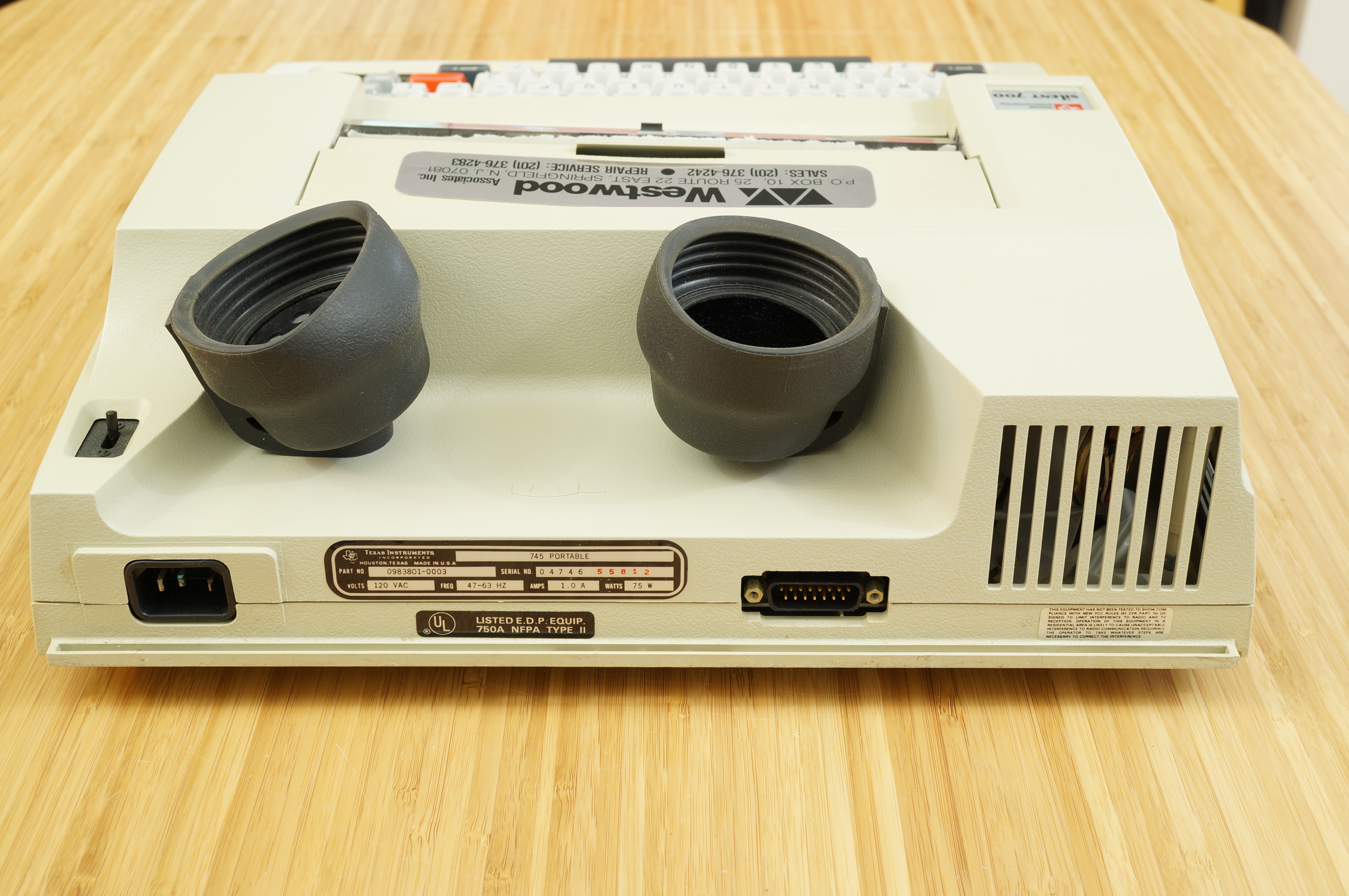 Rear view showing I/O ports and acoustic coupler housing