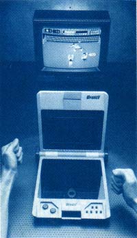 1989 COMPUTE! Magazine press photo of U-Force with Power Bar accessory